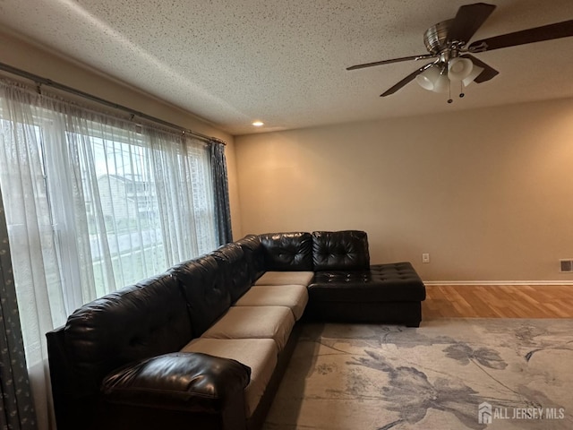741 S Middlesex Ave S, Colonia, NJ 07067 - living area featuring wood finished floors, baseboards, ceiling fan, recessed lighting, and a textured ceiling