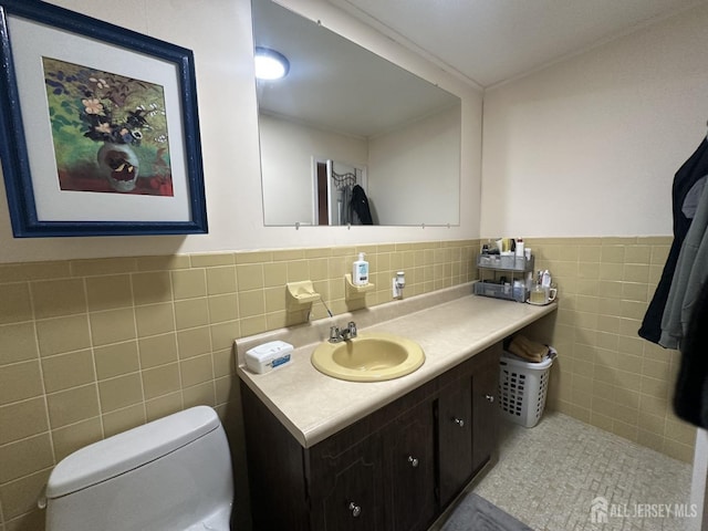 741 S Middlesex Ave S, Colonia, NJ 07067 - half bathroom featuring tile walls, toilet, vanity, and wainscoting
