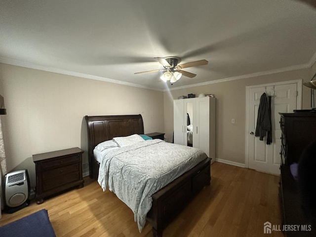 741 S Middlesex Ave S, Colonia, NJ 07067 - bedroom with light wood-style flooring, ornamental molding, and a ceiling fan