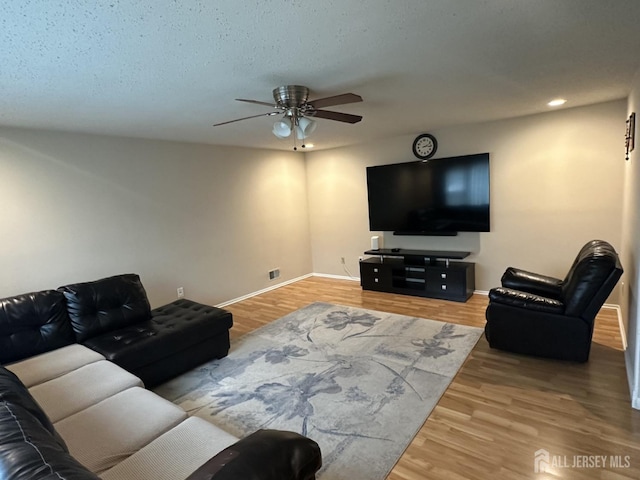 741 S Middlesex Ave S, Colonia, NJ 07067 - living room with a ceiling fan, wood finished floors, baseboards, and recessed lighting