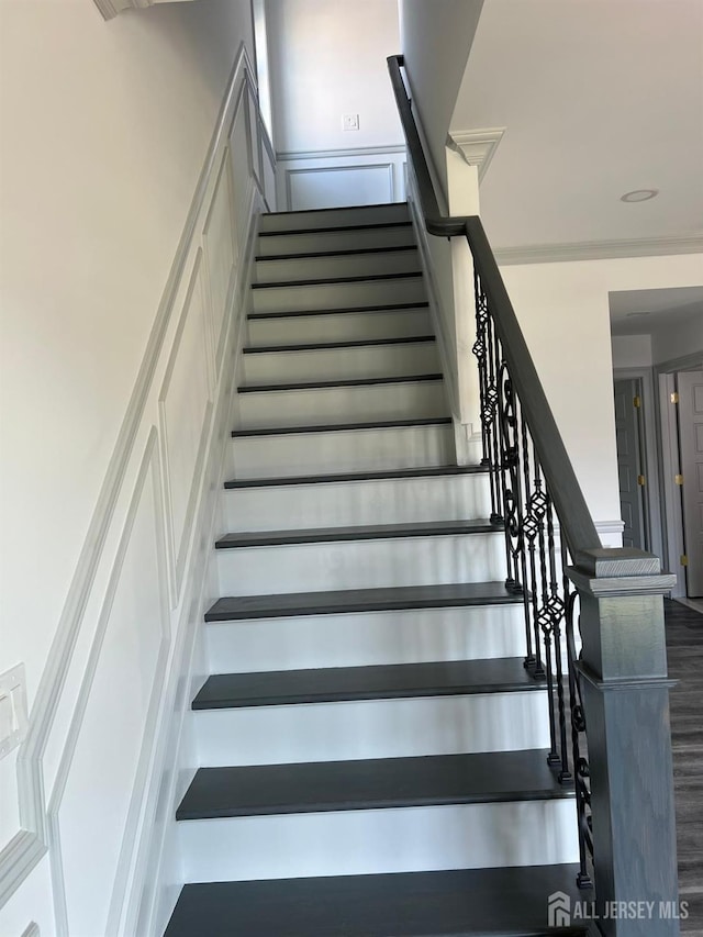 stairway with crown molding