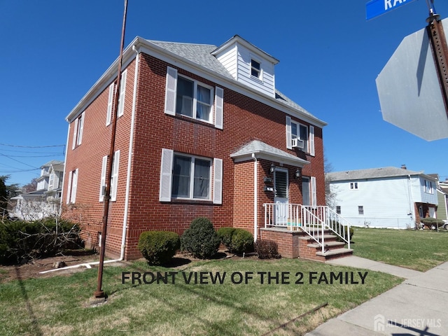123 Heald St, Carteret, NJ 07008 - traditional style home featuring brick siding and a front yard