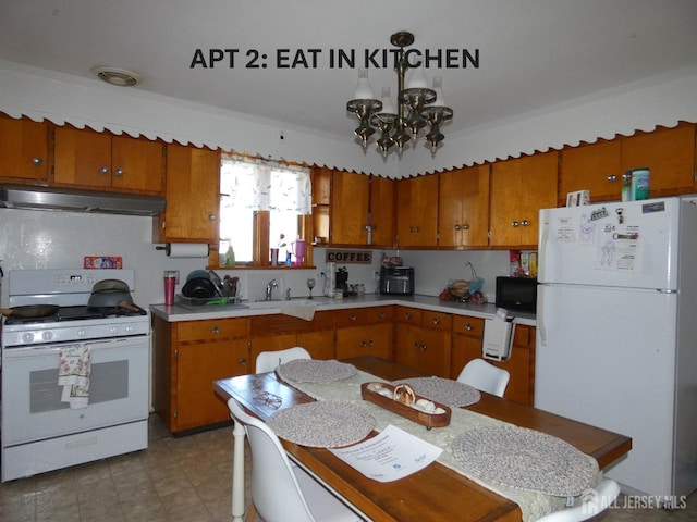 123 Heald St, Carteret, NJ 07008 - kitchen featuring white appliances, under cabinet range hood, light countertops, brown cabinets, and a chandelier