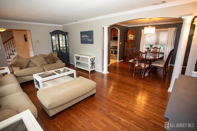 1 Stradford Rd, Sayreville, NJ 08859 - living room with ornate columns, arched walkways, a chandelier, stairs, and wood finished floors