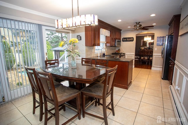 1 Stradford Rd, Sayreville, NJ 08859 - dining room with baseboard heating, a decorative wall, crown molding, a chandelier, and recessed lighting