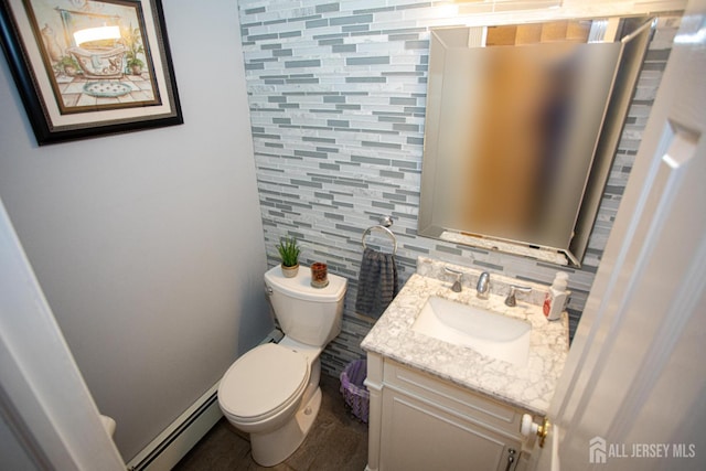 1 Stradford Rd, Sayreville, NJ 08859 - half bath featuring a baseboard heating unit, vanity, tasteful backsplash, and tile walls