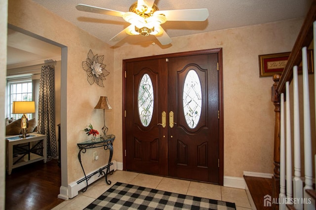 1 Stradford Rd, Sayreville, NJ 08859 - entrance foyer with baseboard heating, a ceiling fan, and light tile patterned floors