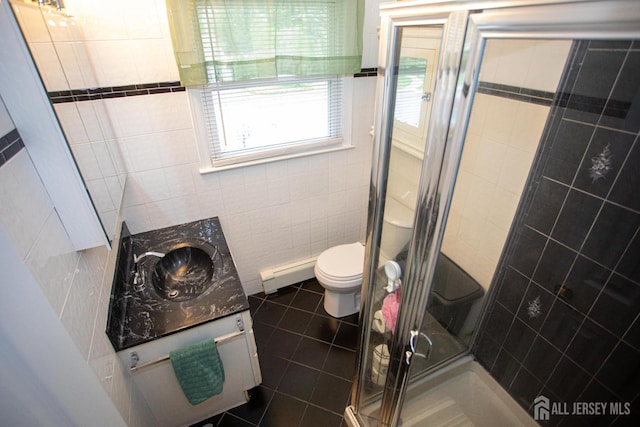 1 Stradford Rd, Sayreville, NJ 08859 - bathroom with tile walls, a stall shower, vanity, tile patterned floors, and a baseboard radiator
