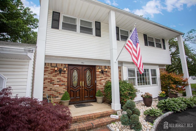 1 Stradford Rd, Sayreville, NJ 08859 - view of front of house featuring a porch and brick siding