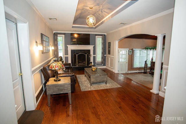 1 Stradford Rd, Sayreville, NJ 08859 - living area with arched walkways, wood finished floors, ornamental molding, a high end fireplace, and baseboard heating