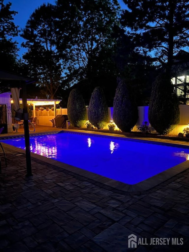 1 Stradford Rd, Sayreville, NJ 08859 - view of pool featuring a patio area
