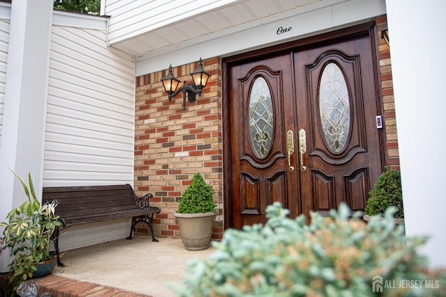 1 Stradford Rd, Sayreville, NJ 08859 - property entrance featuring covered porch and brick siding