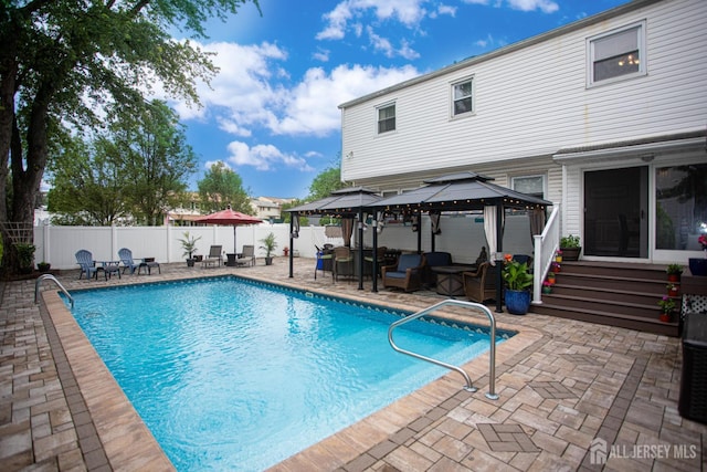 1 Stradford Rd, Sayreville, NJ 08859 - view of swimming pool with a gazebo, a patio, a fenced backyard, and an outdoor living space
