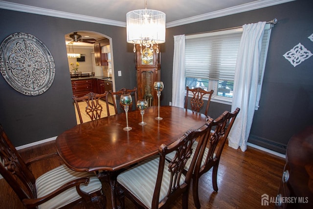 1 Stradford Rd, Sayreville, NJ 08859 - dining room featuring arched walkways, a chandelier, wood finished floors, and ornamental molding