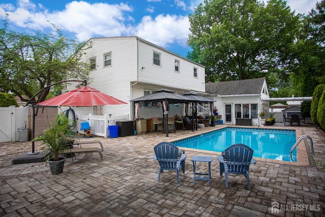 1 Stradford Rd, Sayreville, NJ 08859 - view of pool featuring a gate, a gazebo, a fenced backyard, a patio area, and an outbuilding
