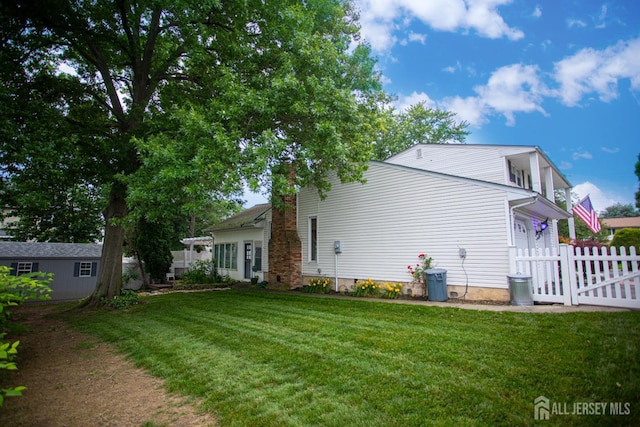 1 Stradford Rd, Sayreville, NJ 08859 - back of house featuring a chimney