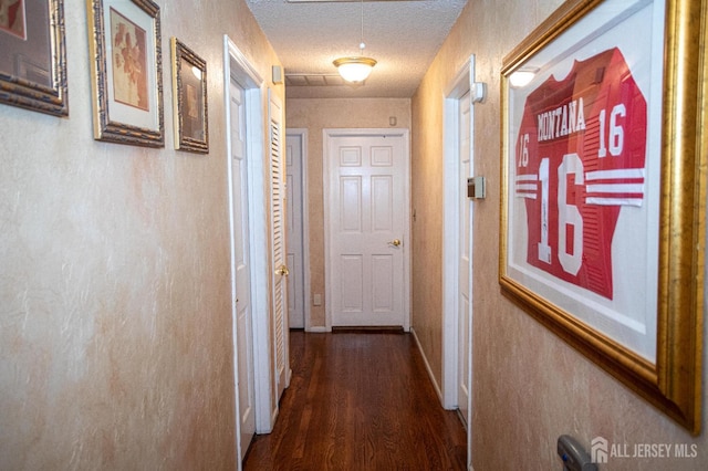 1 Stradford Rd, Sayreville, NJ 08859 - corridor with dark wood-style flooring and a textured ceiling