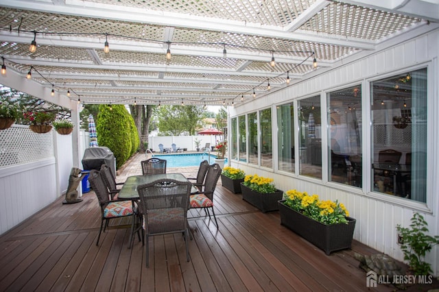 1 Stradford Rd, Sayreville, NJ 08859 - wooden deck with outdoor dining area, a pergola, a fenced backyard, and a grill
