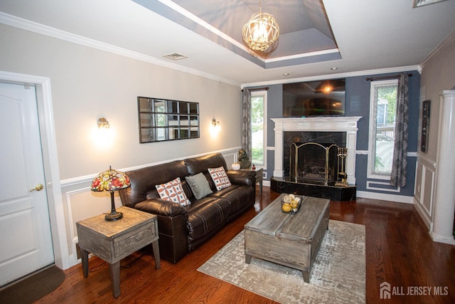 1 Stradford Rd, Sayreville, NJ 08859 - living area featuring ornamental molding, healthy amount of natural light, wood finished floors, a chandelier, and wainscoting