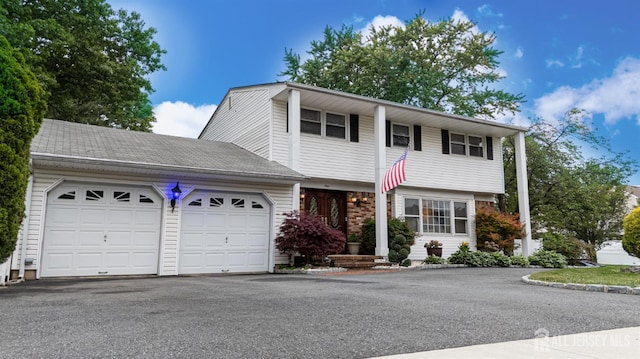 1 Stradford Rd, Sayreville, NJ 08859 - view of front of house with an attached garage and driveway