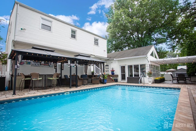 1 Stradford Rd, Sayreville, NJ 08859 - outdoor pool featuring a gazebo, a patio area, an outdoor structure, and outdoor lounge area
