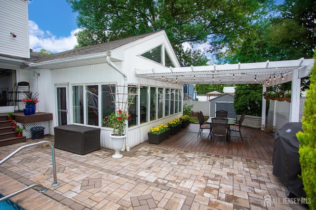 1 Stradford Rd, Sayreville, NJ 08859 - view of patio / terrace featuring a grill, outdoor dining space, a pergola, a shed, and a wooden deck