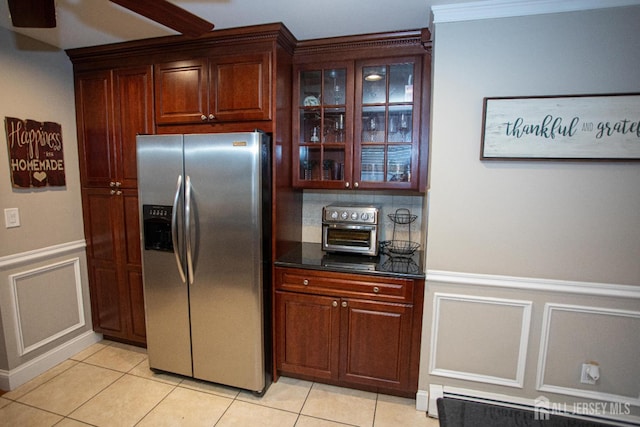 1 Stradford Rd, Sayreville, NJ 08859 - kitchen featuring stainless steel fridge, light tile patterned flooring, a decorative wall, wainscoting, and glass insert cabinets