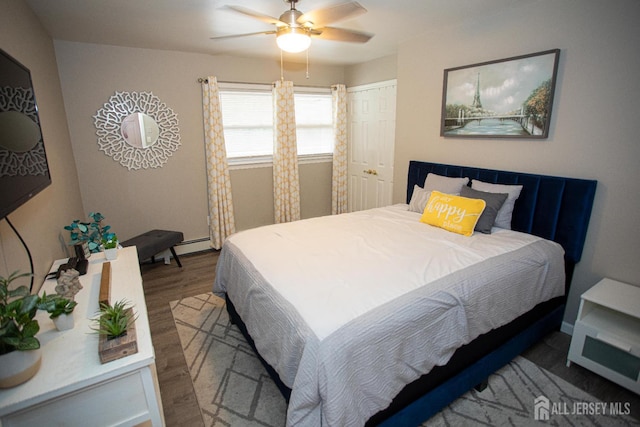 1 Stradford Rd, Sayreville, NJ 08859 - bedroom featuring wood finished floors, a baseboard heating unit, and ceiling fan