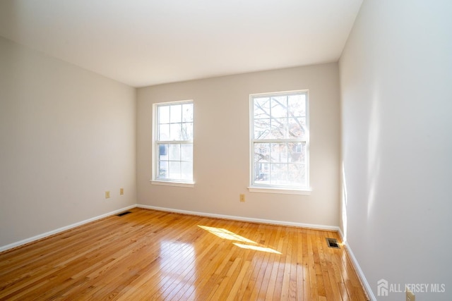 17 Larkspur Dr, South Brunswick, NJ 08810 - unfurnished room with wood-type flooring, visible vents, and baseboards