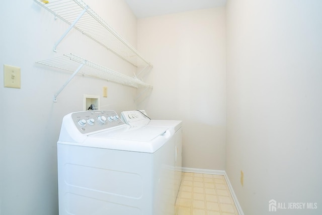 17 Larkspur Dr, South Brunswick, NJ 08810 - clothes washing area featuring tile patterned floors, washing machine and dryer, laundry area, and baseboards