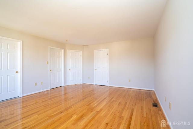 17 Larkspur Dr, South Brunswick, NJ 08810 - unfurnished room featuring visible vents, light wood-type flooring, and baseboards