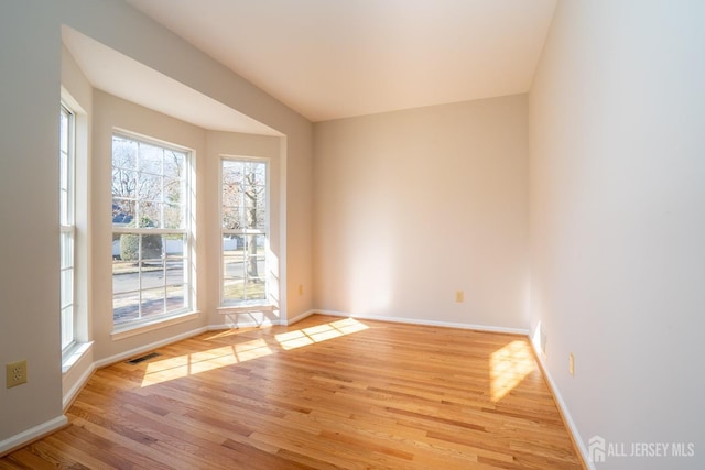17 Larkspur Dr, South Brunswick, NJ 08810 - spare room featuring visible vents, baseboards, and light wood-style floors