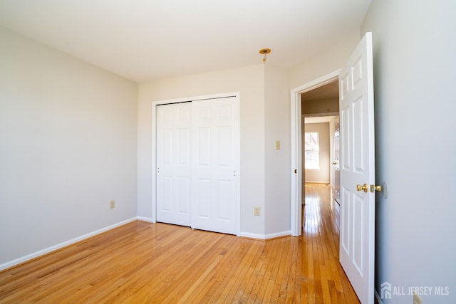 17 Larkspur Dr, South Brunswick, NJ 08810 - unfurnished bedroom with light wood-style floors, a closet, and baseboards