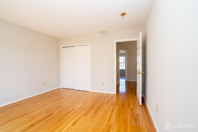 17 Larkspur Dr, South Brunswick, NJ 08810 - unfurnished bedroom with a closet, baseboards, and light wood finished floors
