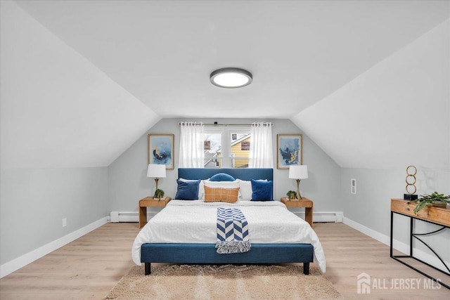 bedroom with a baseboard radiator, wood finished floors, vaulted ceiling, and baseboards