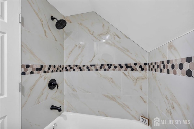 details featuring washtub / shower combination