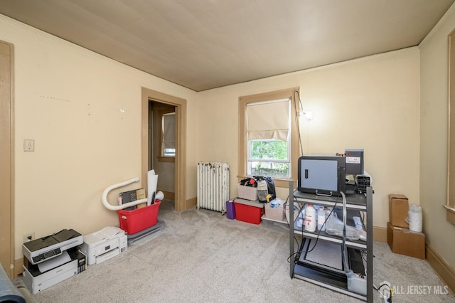 rec room featuring carpet and radiator heating unit