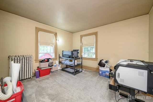 interior space featuring carpet floors and radiator heating unit
