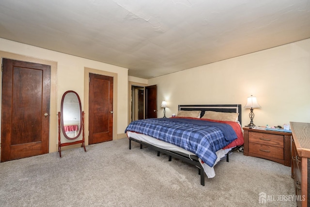 bedroom with light carpet