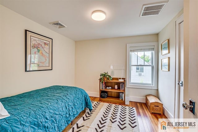 12 S 8th Ave, Highland Park, NJ 08904 - bedroom with wood finished floors and baseboards