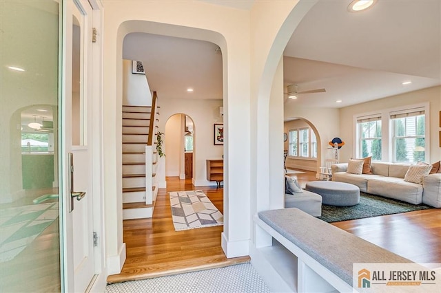 12 S 8th Ave, Highland Park, NJ 08904 - entrance foyer featuring arched walkways, a ceiling fan, light wood-type flooring, stairs, and recessed lighting
