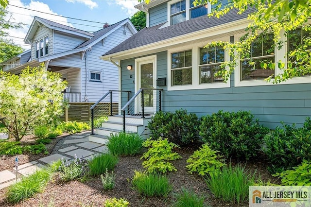 12 S 8th Ave, Highland Park, NJ 08904 - view of front of home with a shingled roof