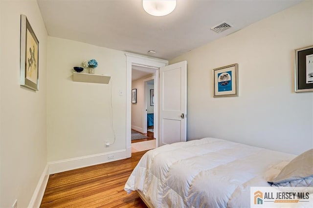 12 S 8th Ave, Highland Park, NJ 08904 - bedroom with wood finished floors and baseboards