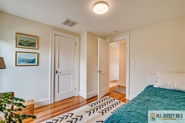 12 S 8th Ave, Highland Park, NJ 08904 - bedroom with light wood finished floors and baseboards