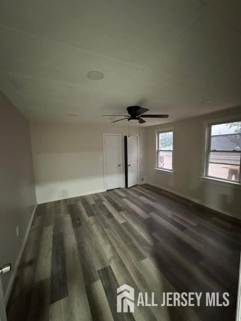 601 Ridgeway Ave, South Amboy, NJ 08879 - spare room featuring dark wood-style flooring, baseboards, and ceiling fan