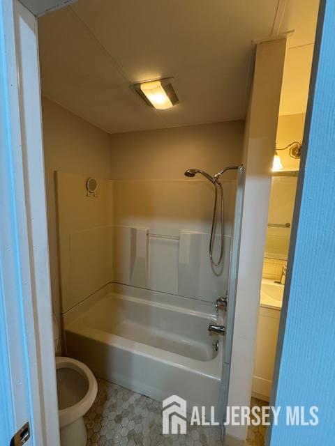 601 Ridgeway Ave, South Amboy, NJ 08879 - full bathroom with toilet, washtub / shower combination, and vanity