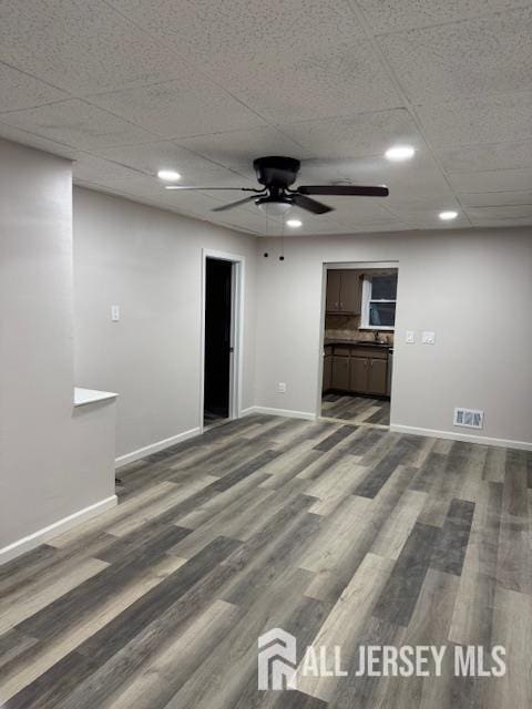 601 Ridgeway Ave, South Amboy, NJ 08879 - unfurnished room featuring baseboards, a ceiling fan, dark wood-style flooring, a drop ceiling, and recessed lighting