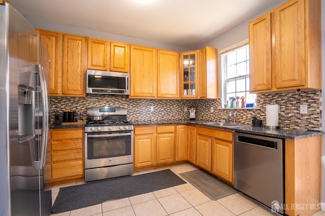 345 Morning Glory Dr, Monroe, NJ 08831 - kitchen featuring stainless steel appliances, a sink, decorative backsplash, glass insert cabinets, and light tile patterned floors