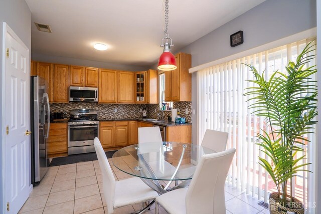 345 Morning Glory Dr, Monroe, NJ 08831 - kitchen featuring appliances with stainless steel finishes, light tile patterned floors, a sink, and plenty of natural light