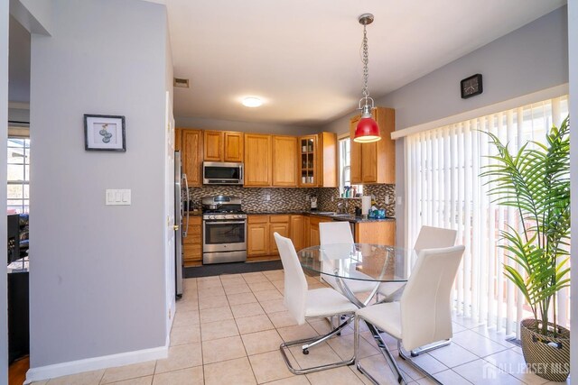 345 Morning Glory Dr, Monroe, NJ 08831 - kitchen with stainless steel appliances, plenty of natural light, decorative backsplash, and dark countertops